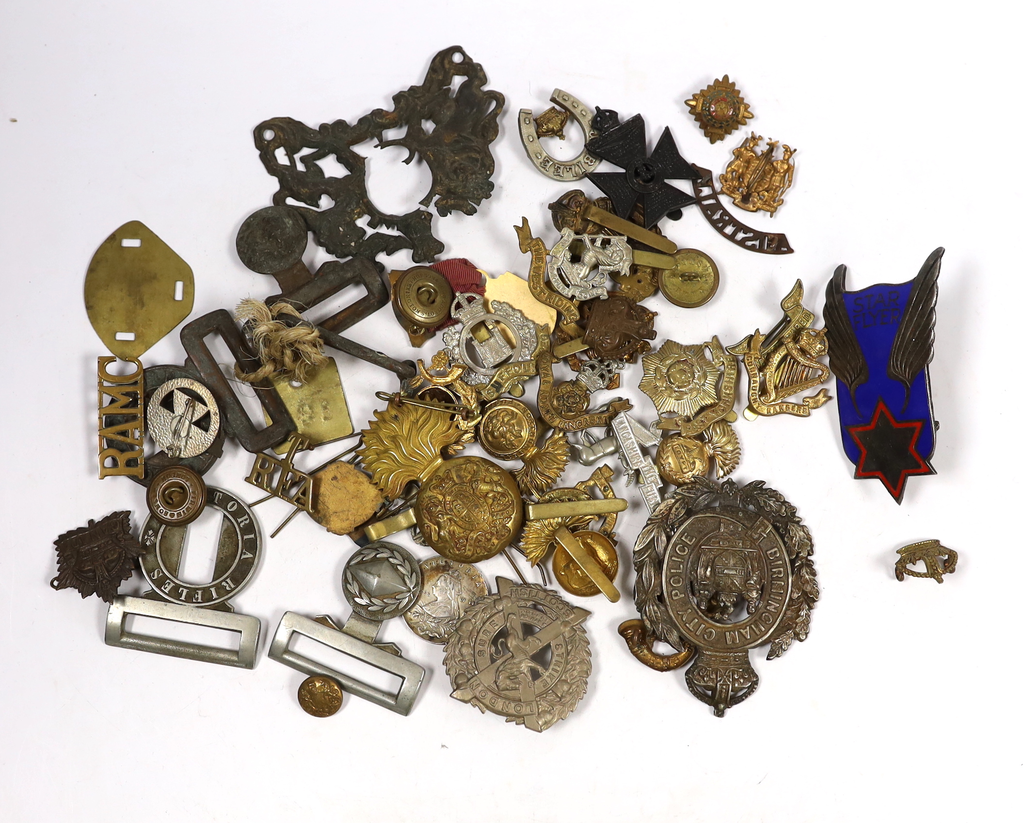 Eighteen military cap badges including Northumberland Fusiliers, East Yorkshire, SWB, the Suffolk Regiment, the Lancashire Fusiliers, Connaught Rangers, North Irish Horse, the West Riding, together with a number of shoul